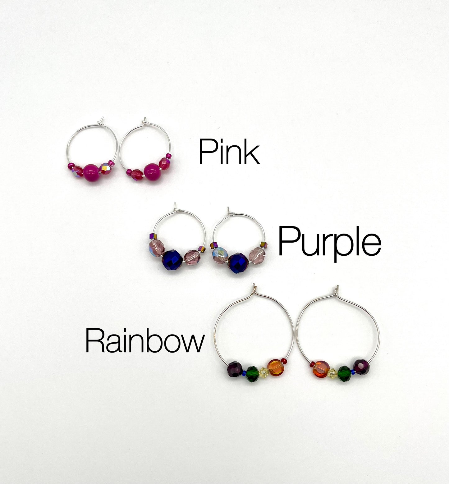 Silver hoop earrings with glass bead detail
