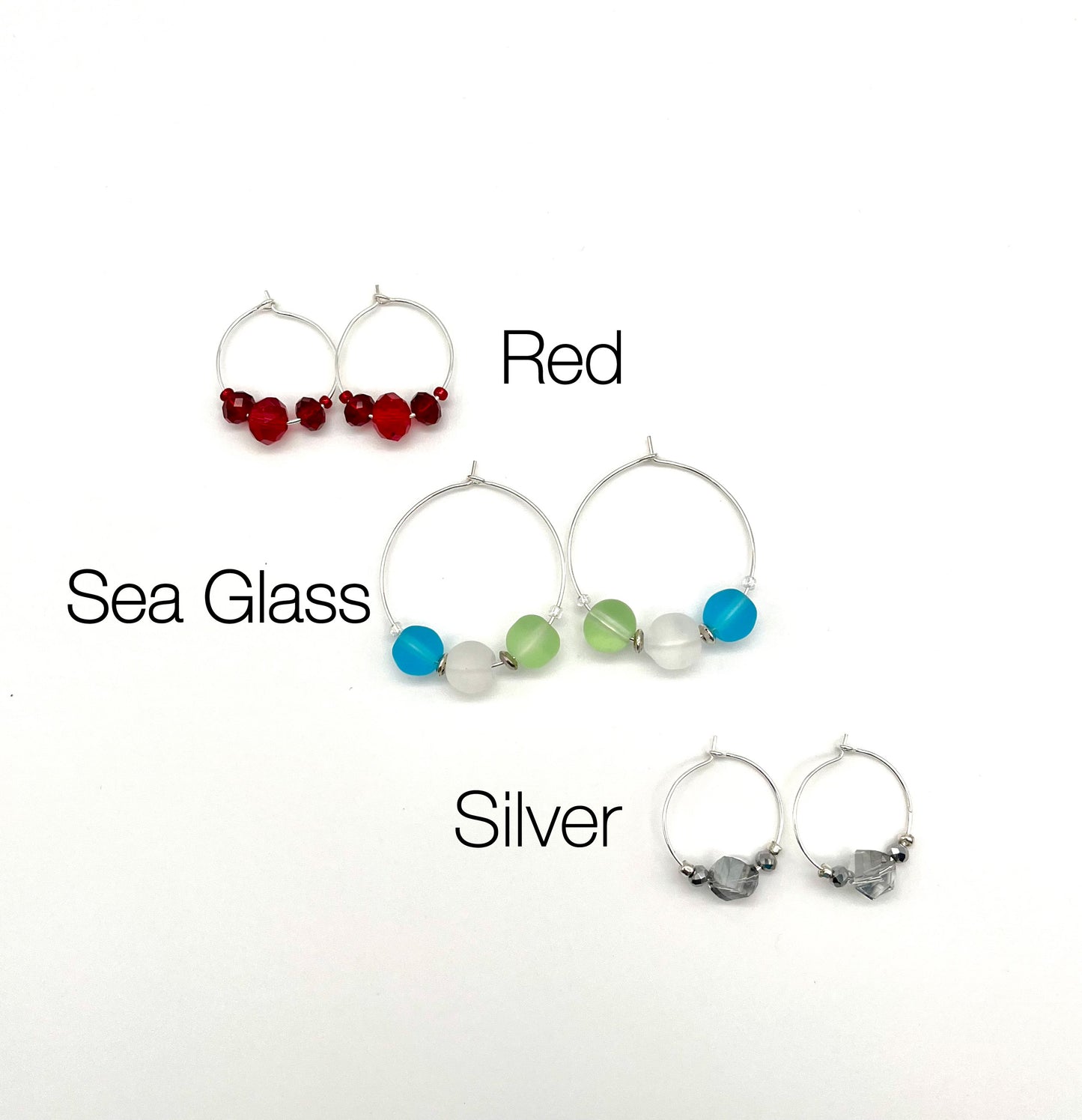 Silver hoop earrings with glass bead detail