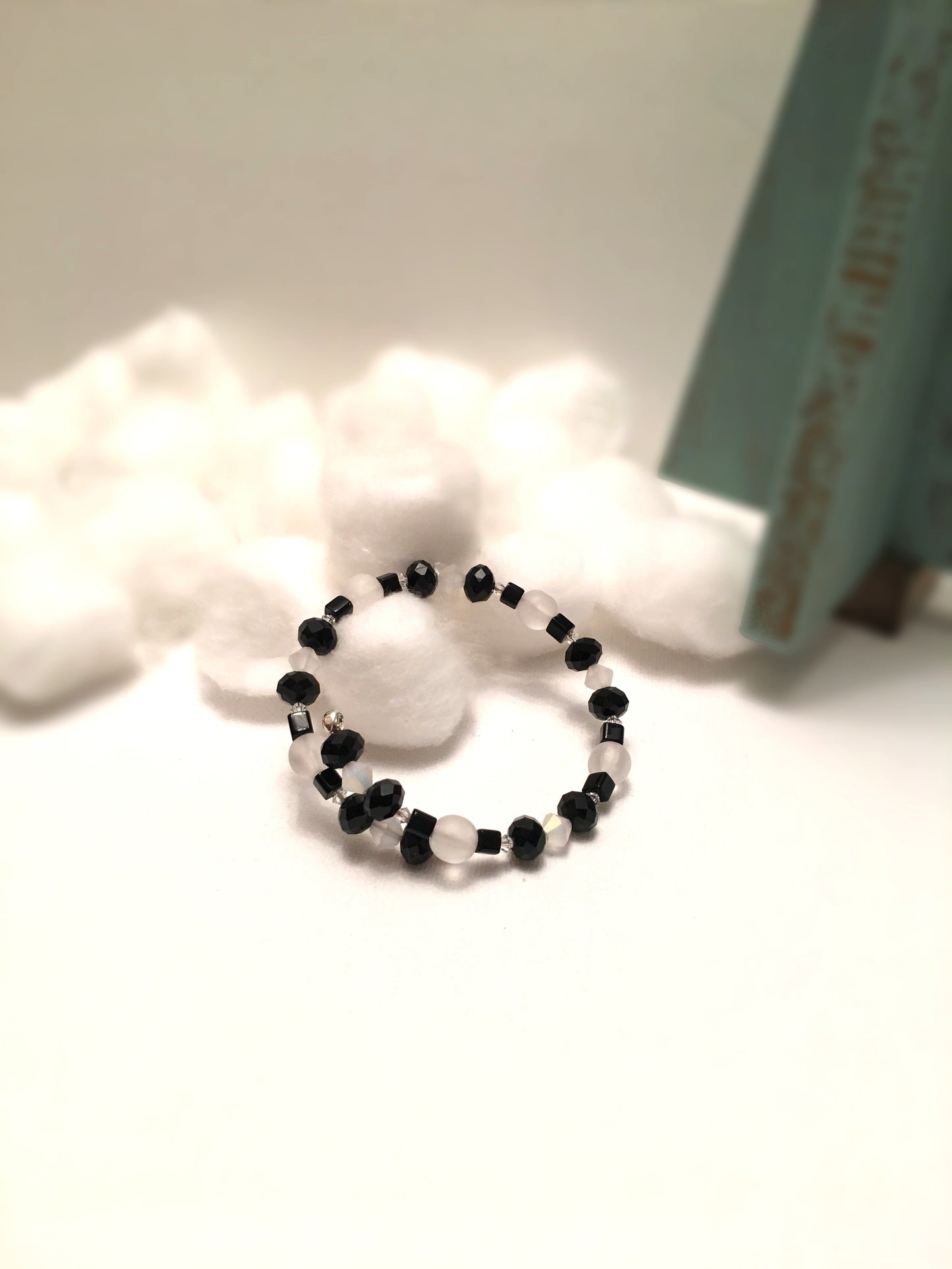 Black faceted and cube beads and white faceted beads memory wire bracelet