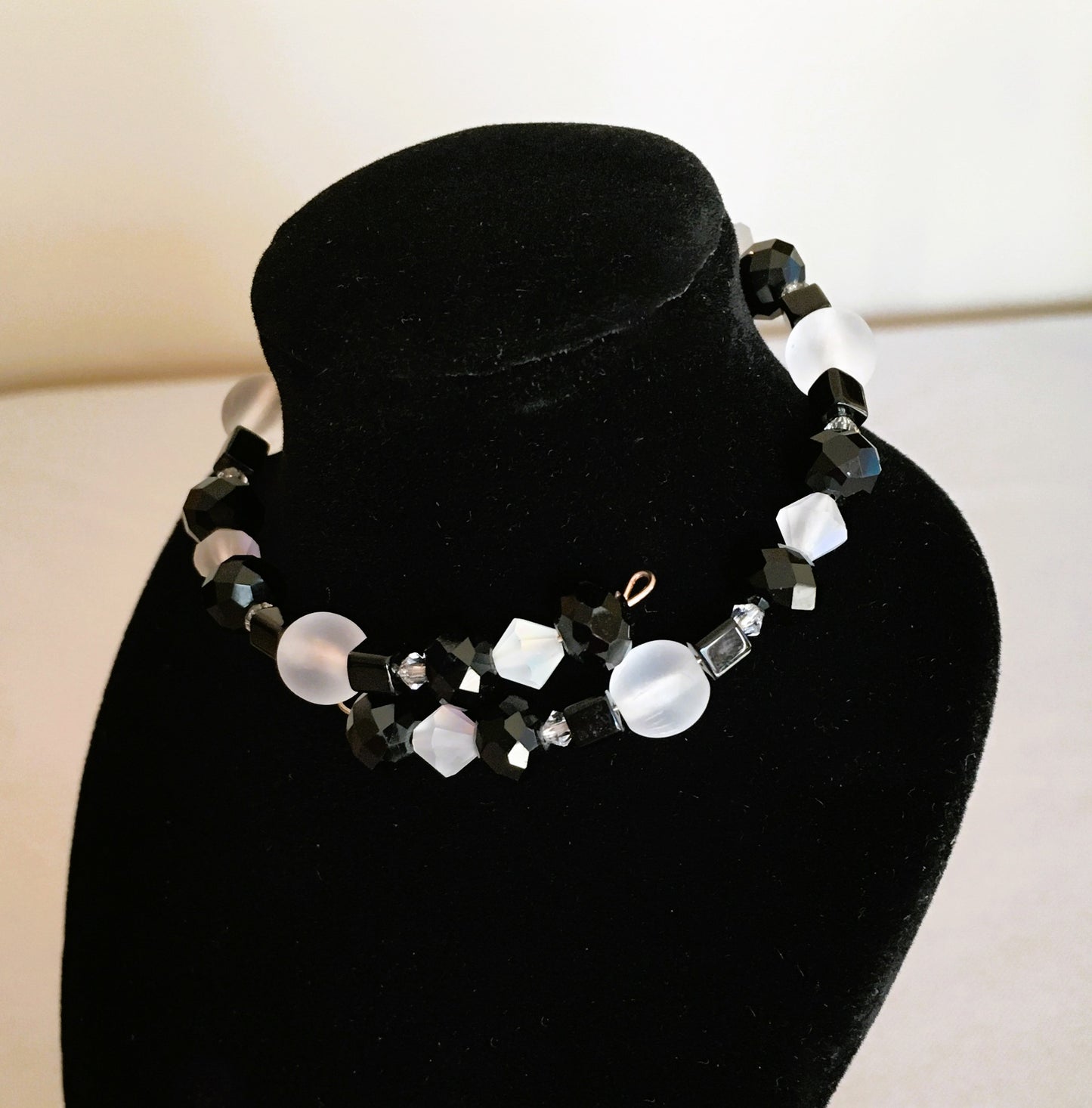 Black faceted and cube beads and white faceted beads memory wire bracelet