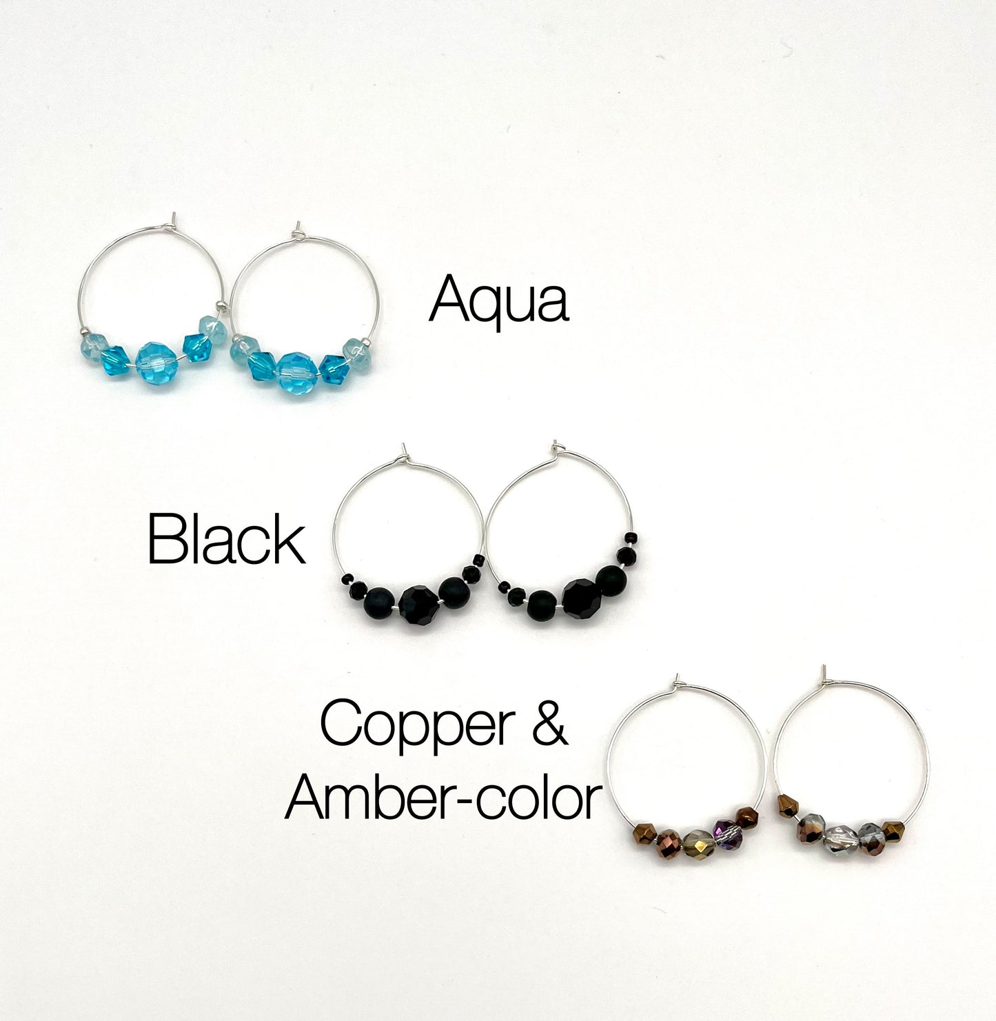 Silver hoop earrings with glass bead detail