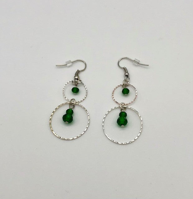 Emerald green glass beads in circle cutout earrings