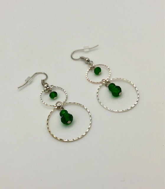 Emerald green glass beads in circle cutout earrings