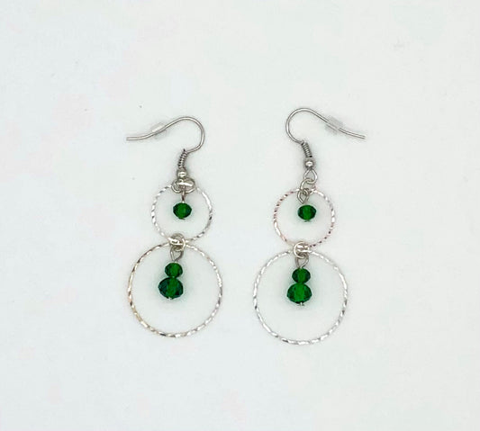 Emerald green glass beads in circle cutout earrings