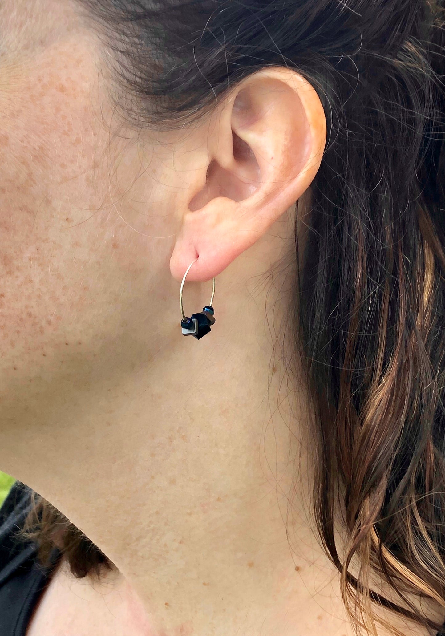 Silver hoop earrings with glass bead detail