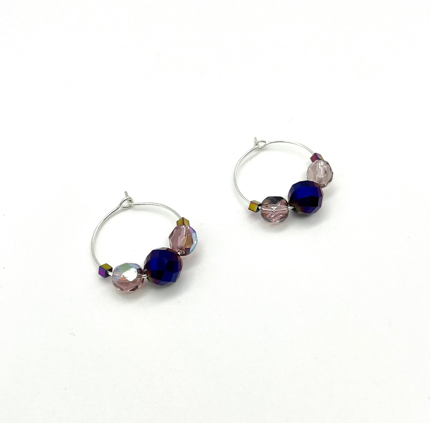 Silver hoop earrings with glass bead detail