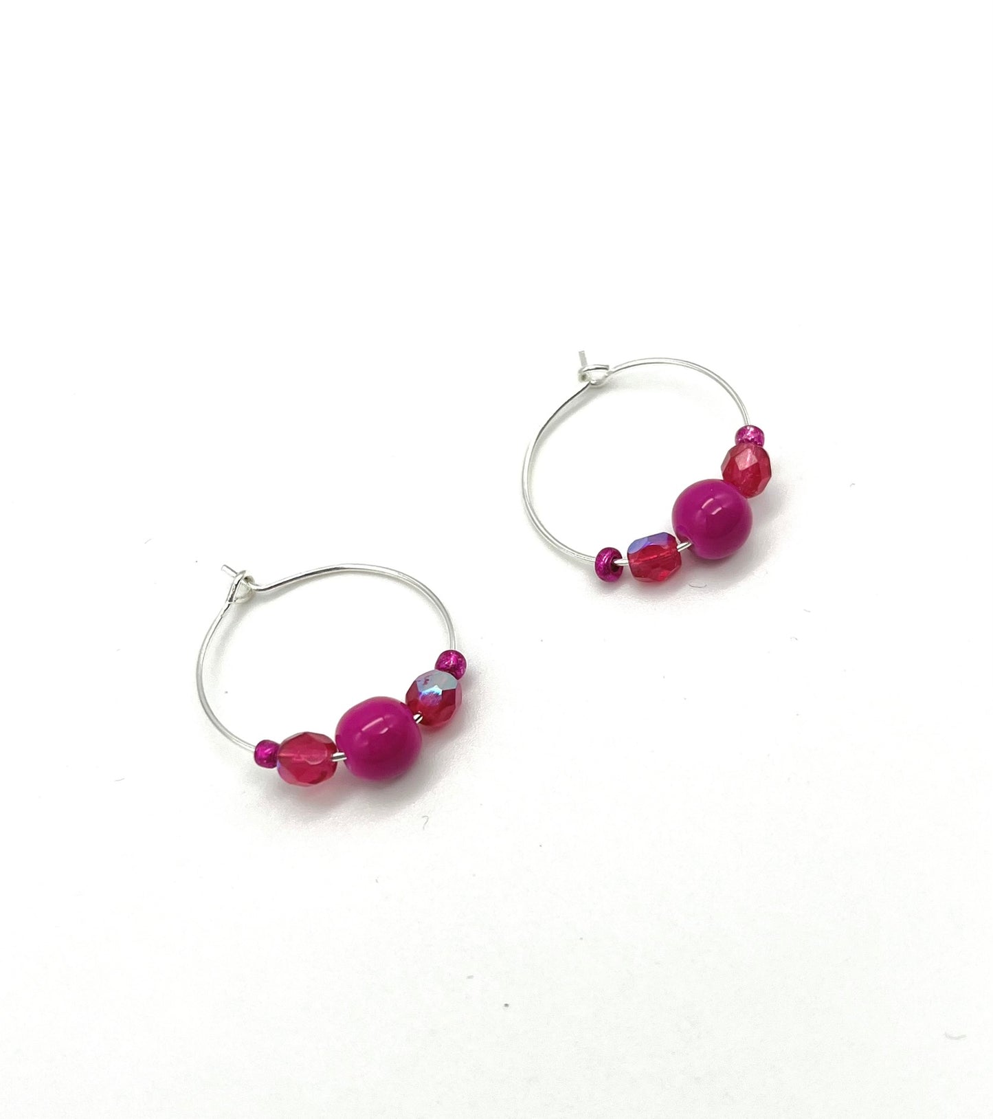 Silver hoop earrings with glass bead detail