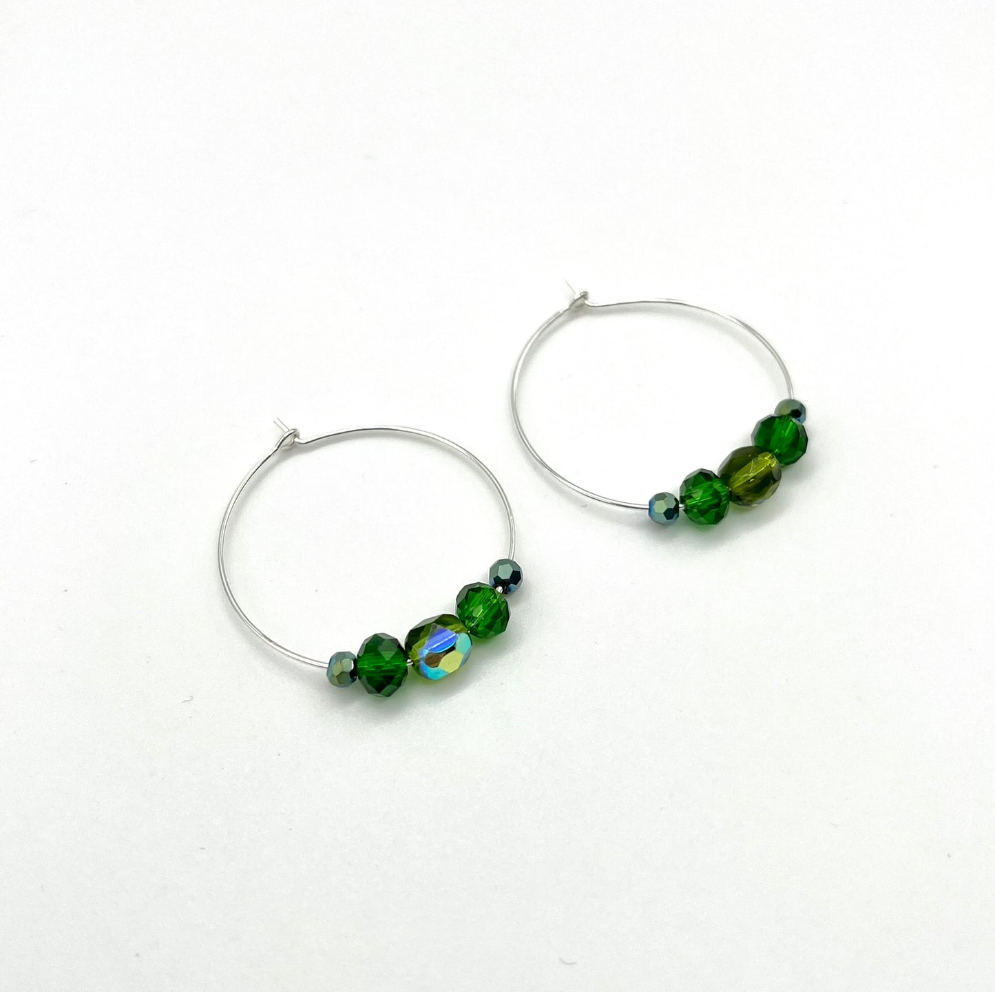 Silver hoop earrings with glass bead detail