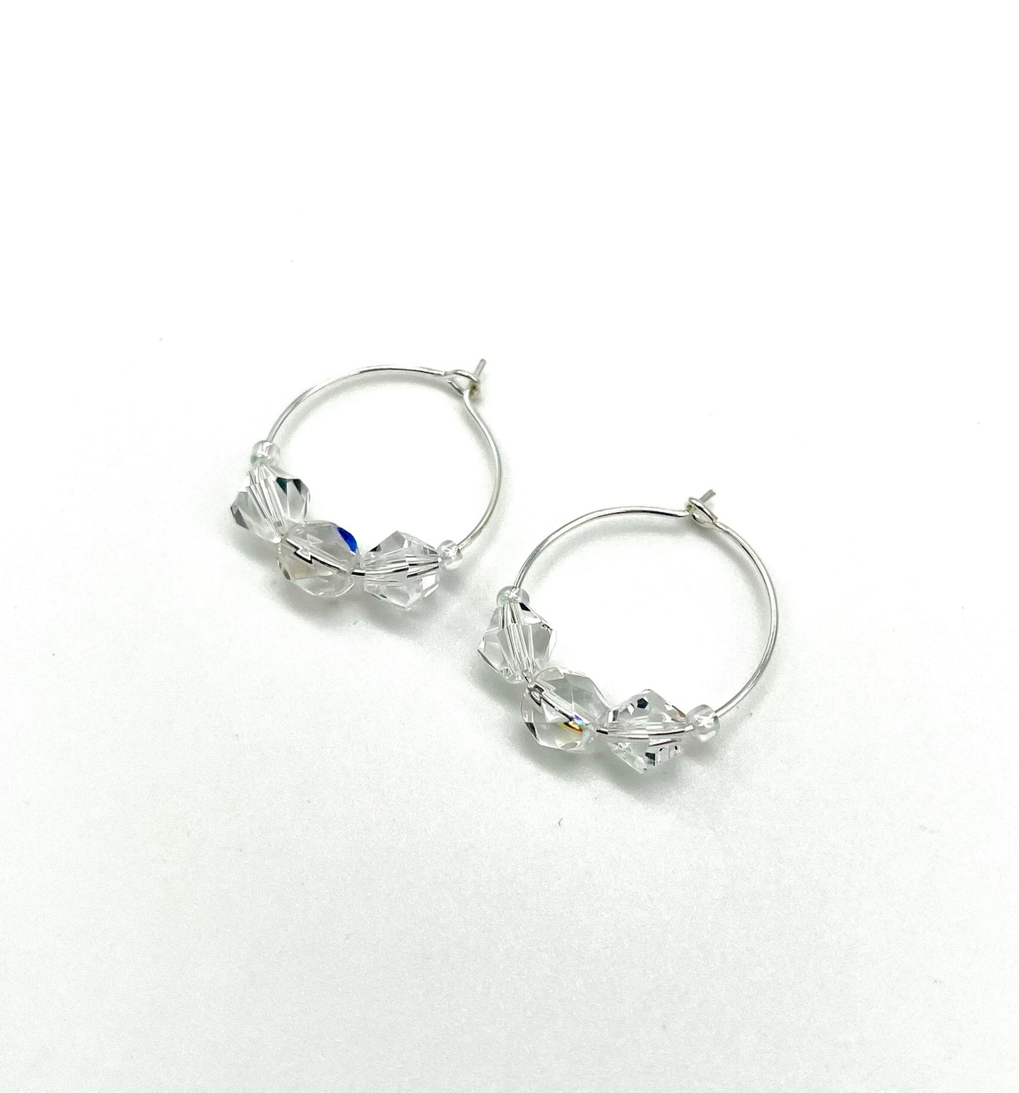 Silver hoop earrings with glass bead detail