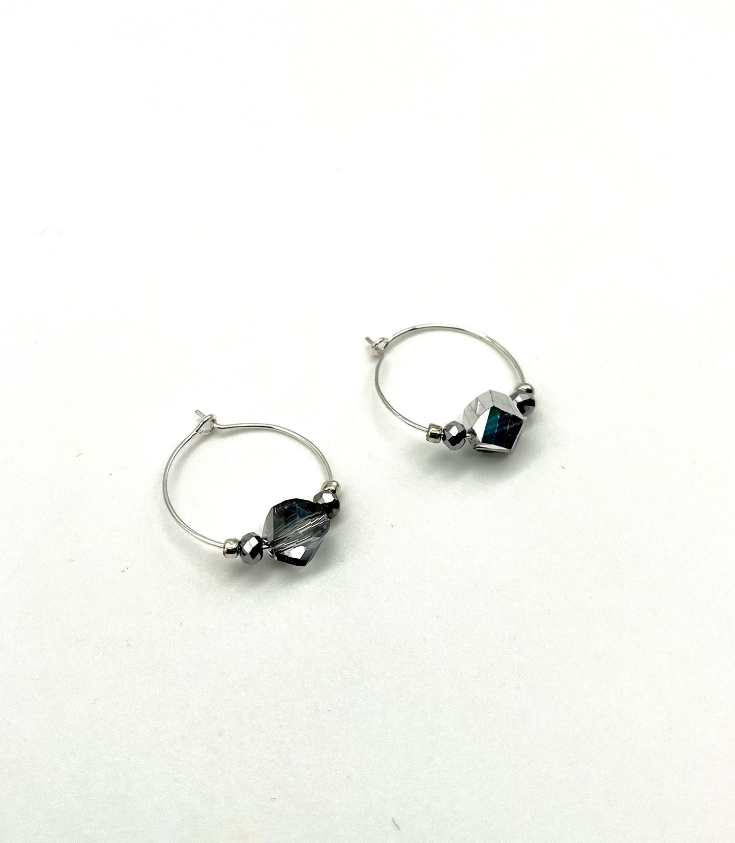 Silver hoop earrings with glass bead detail