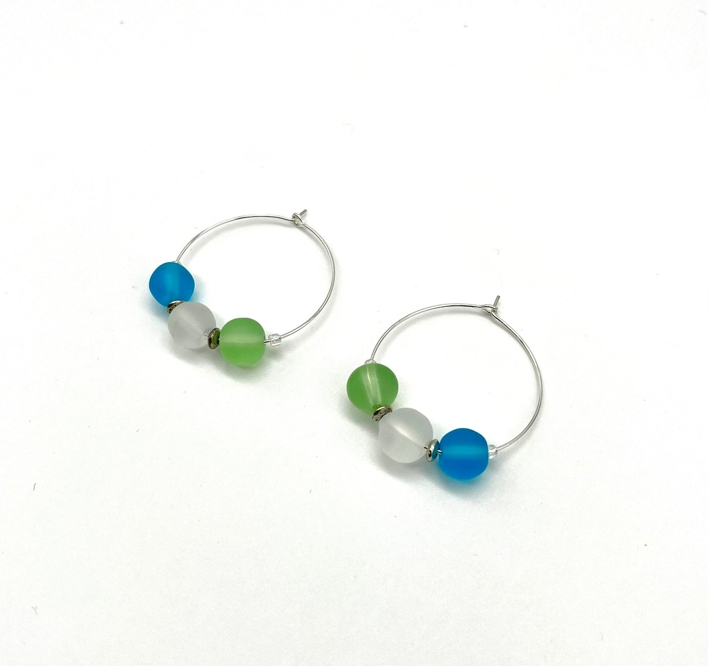 Silver hoop earrings with glass bead detail