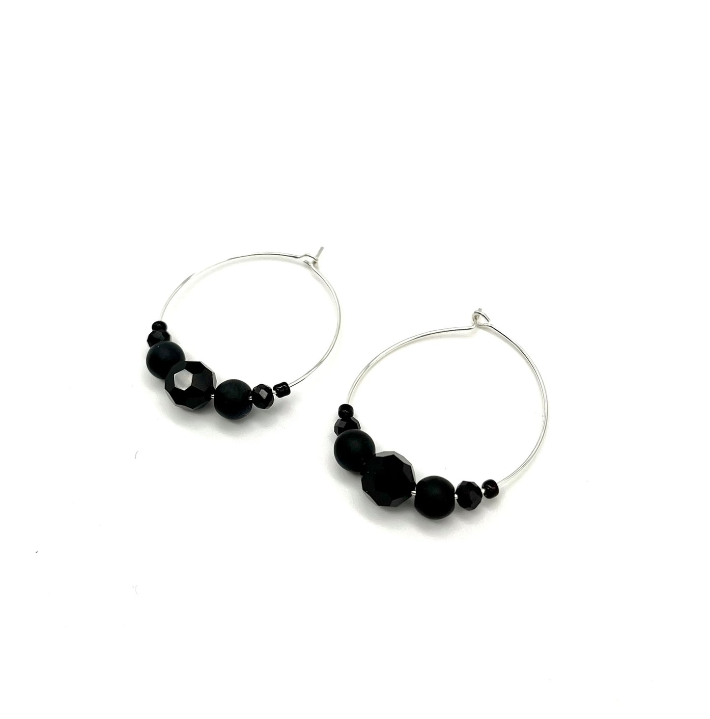 Silver hoop earrings with glass bead detail