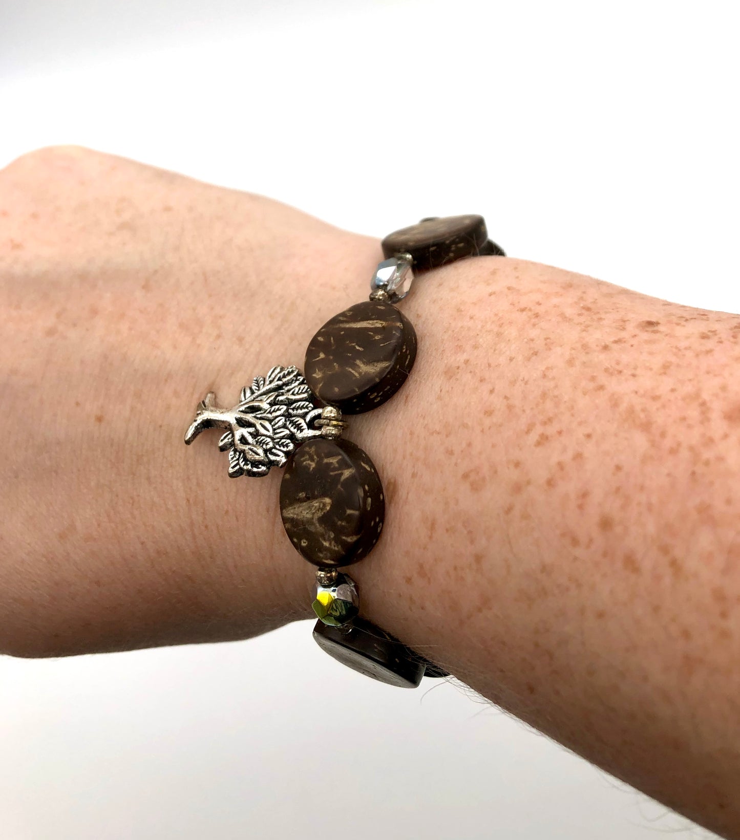 Antique silver round tree charm, round wood bead, amber glass bead stretch bracelet