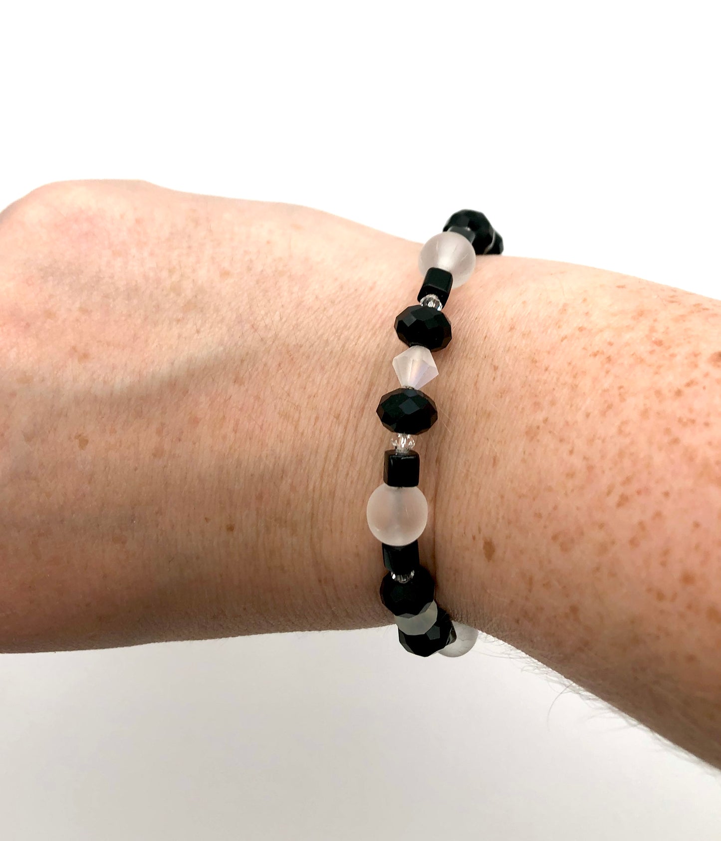Black faceted and cube beads and white faceted beads memory wire bracelet