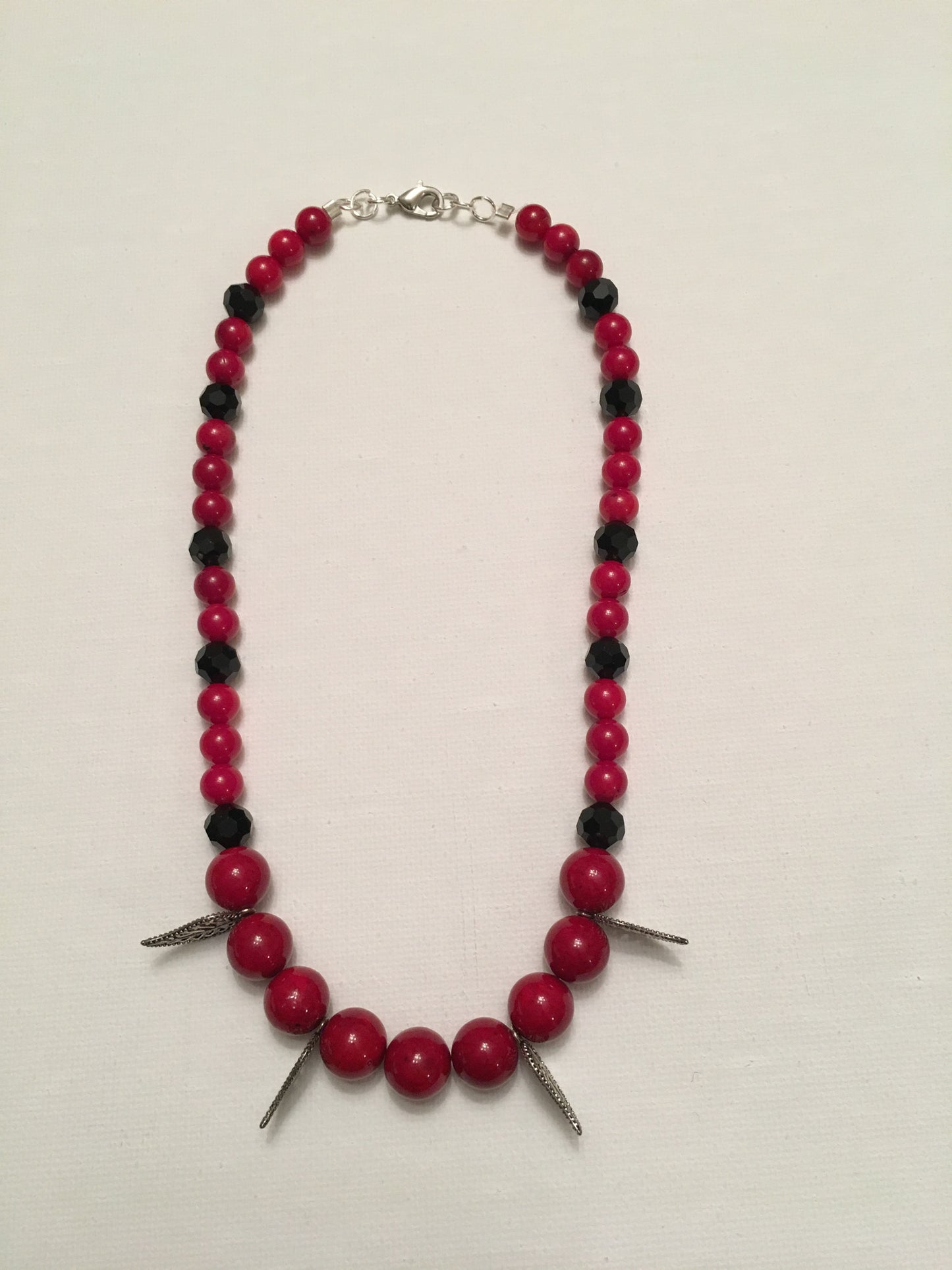 Red round stone and black faceted bead  with leaf detail necklace