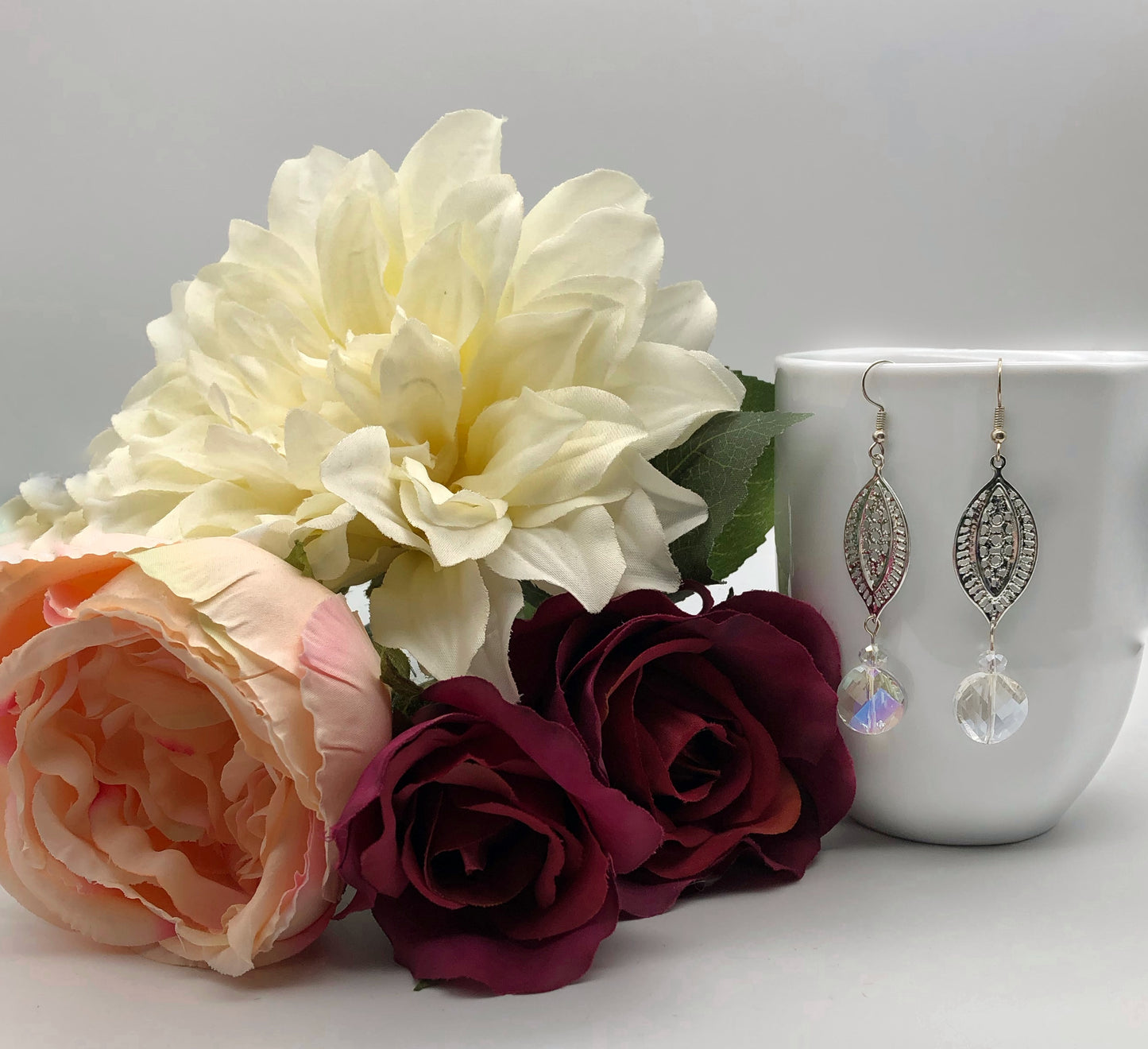 Silver plated paisley cut connector and round crystal glass bead earrings