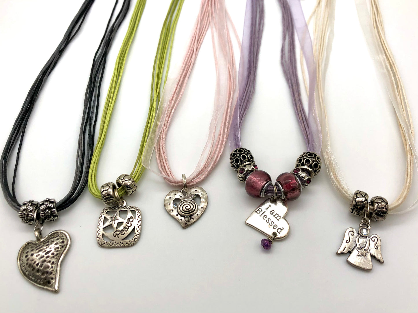 Cotton cord multi strand necklace with positive message pendant
