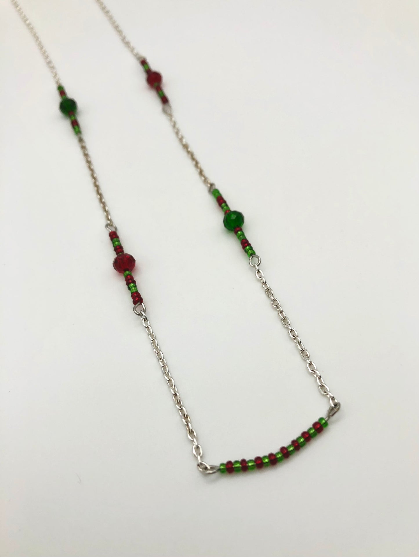 Silver cable chain with red and green seed bead accent necklace