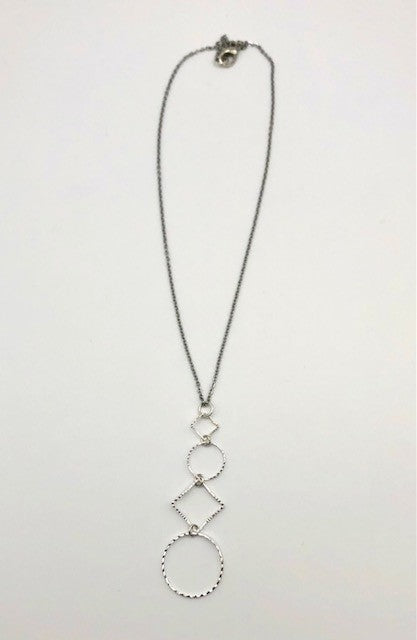 Silver-plated laser cut circle and diamond shape pendant on chain necklace