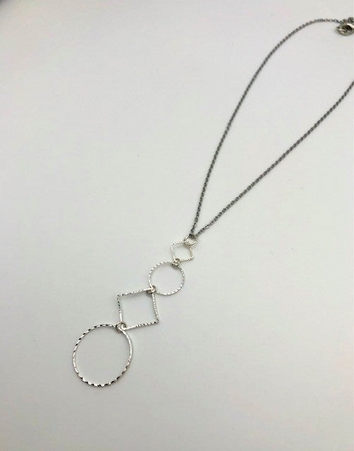 Silver-plated laser cut circle and diamond shape pendant on chain necklace