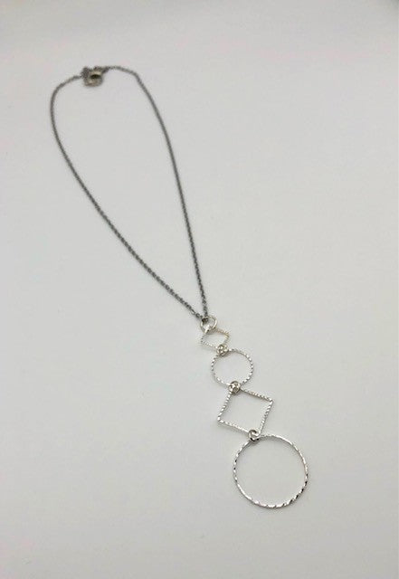 Silver-plated laser cut circle and diamond shape pendant on chain necklace