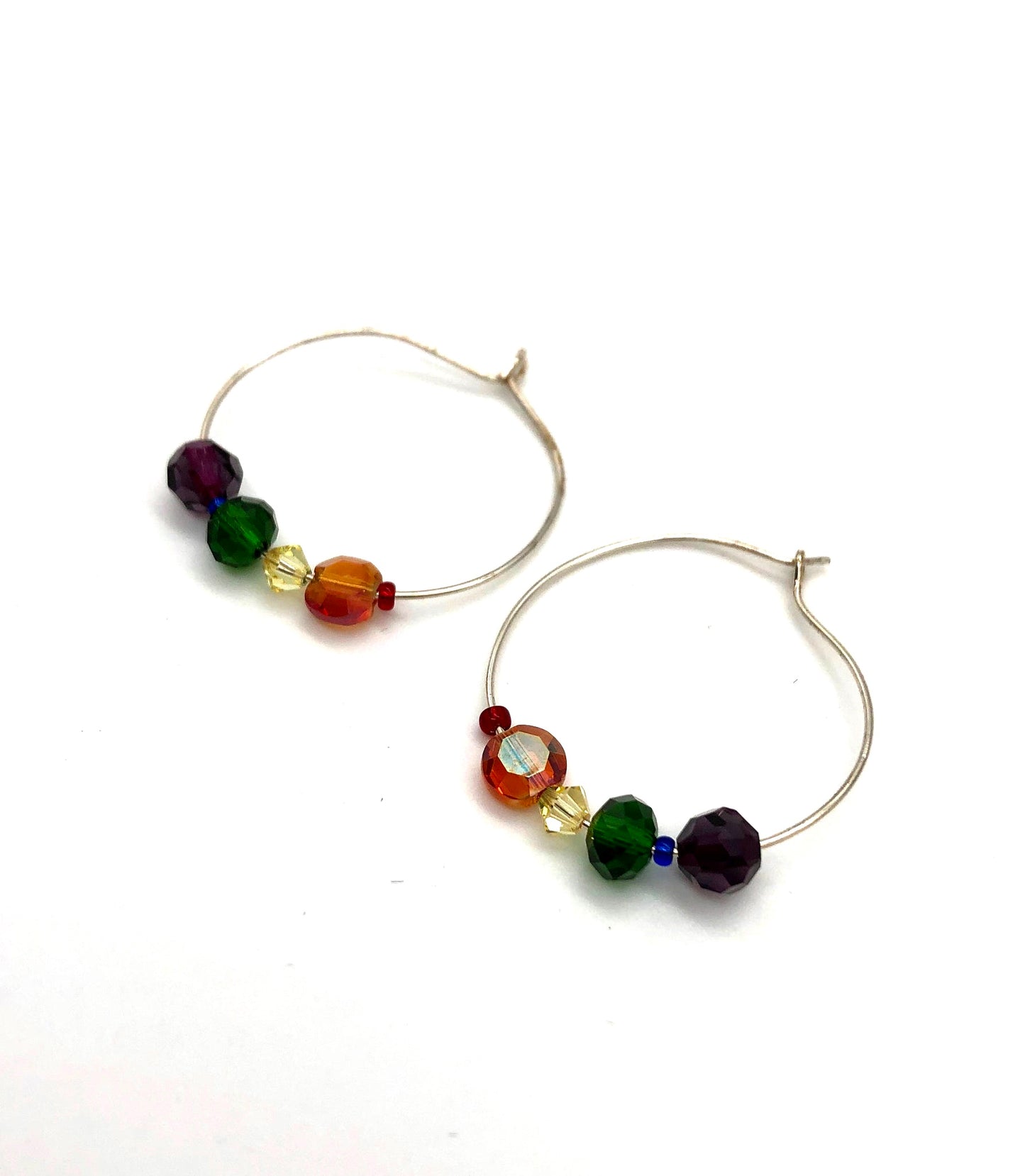 Silver hoop earrings with glass bead detail