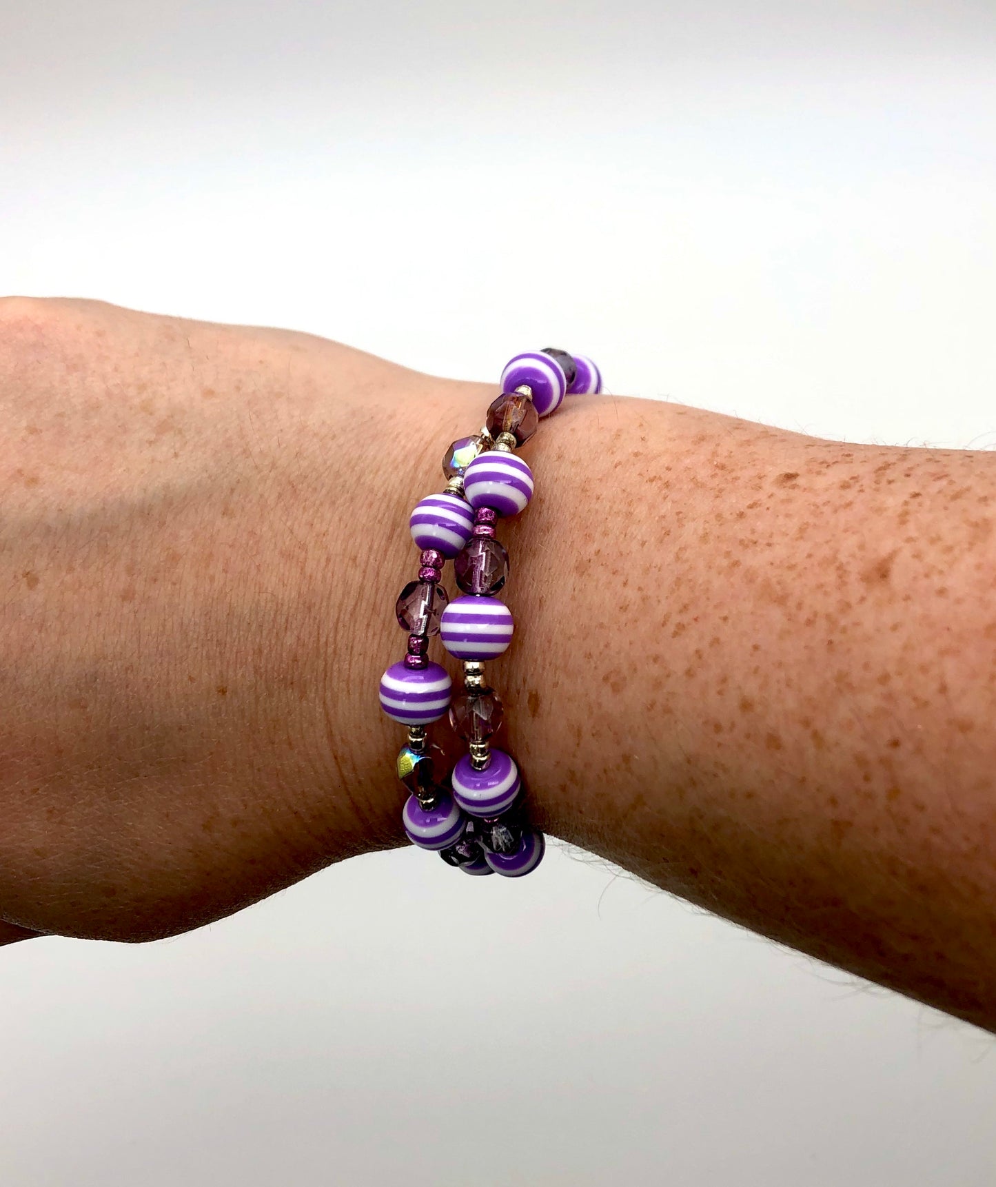 Purple faceted and purple with white stripes memory wire bracelet