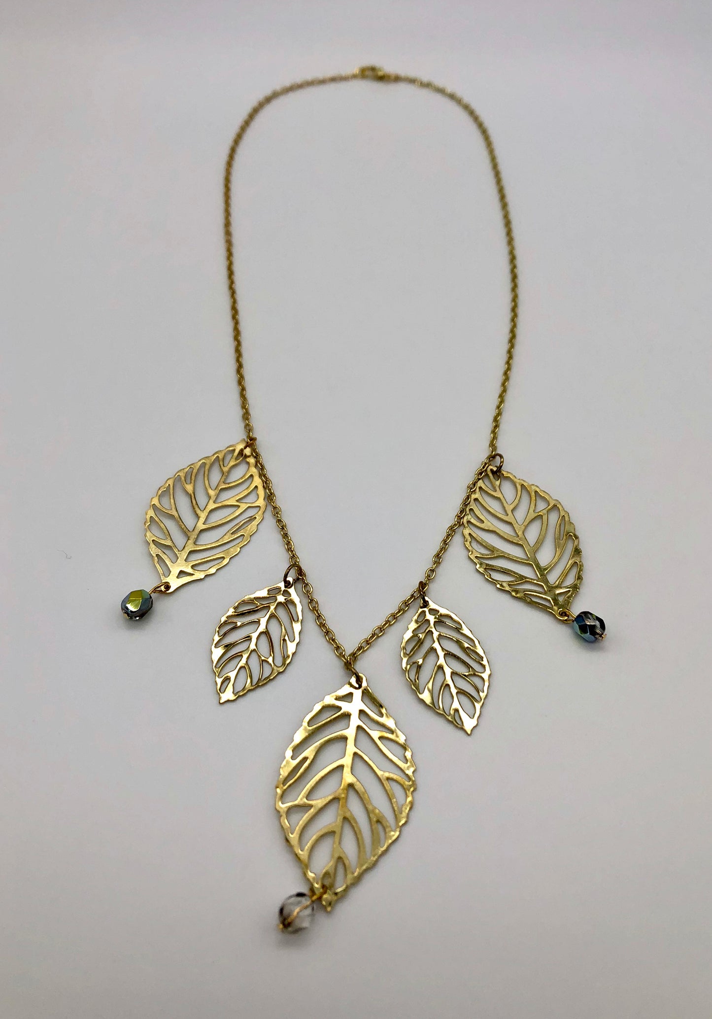 Gold plated leaf cutout dangles chain necklace