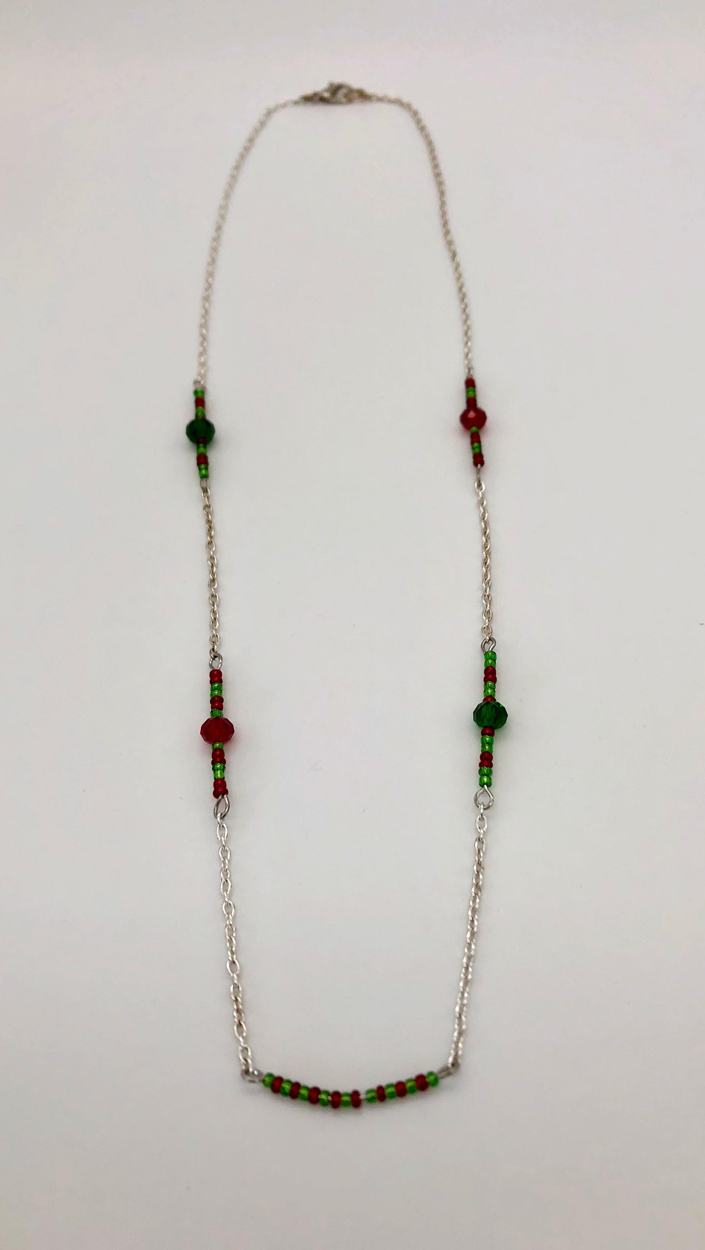 Silver cable chain with red and green seed bead accent necklace