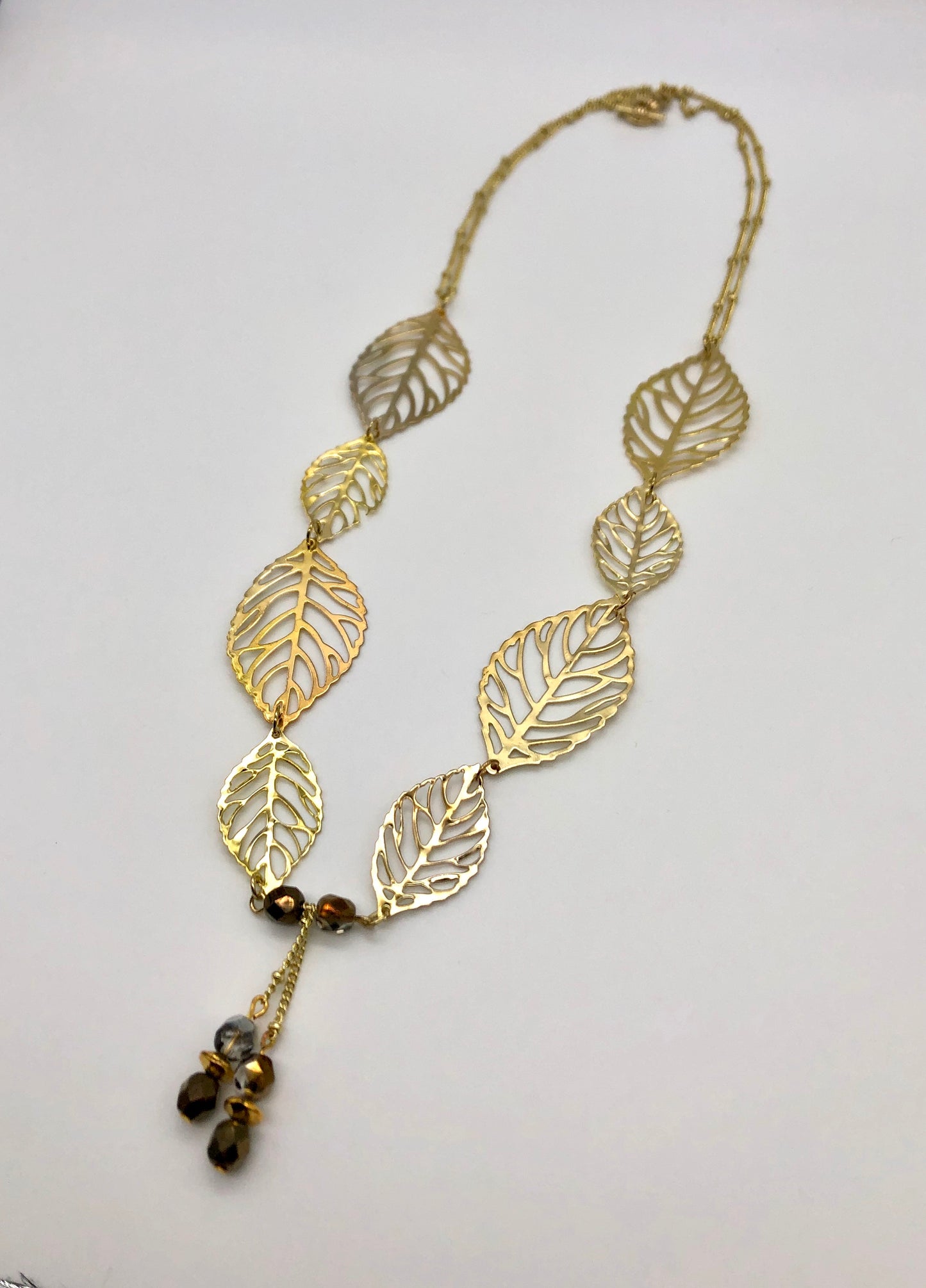 Gold leaf with dangle and double gold ball chain necklace