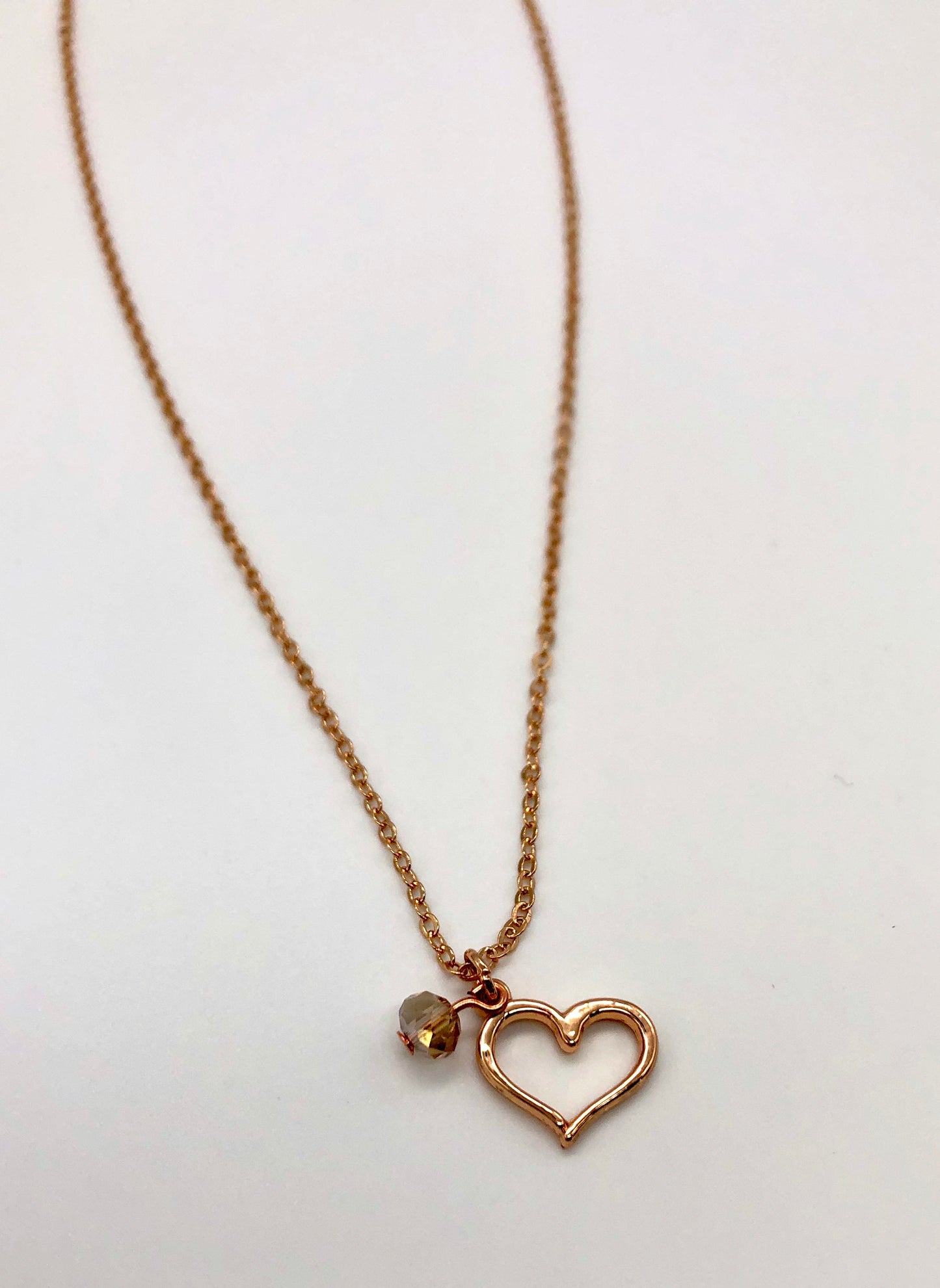 Rose gold plated chain with open heart charm and bead accent necklace