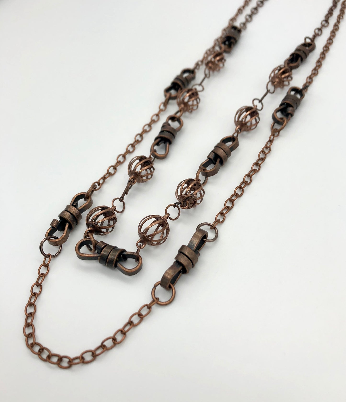 Oxidized copper two-strand chain with rope and curve ball detail necklace