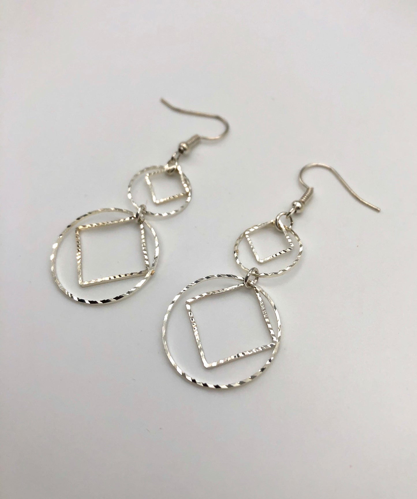 Diamond and circle cutouts drop earrings
