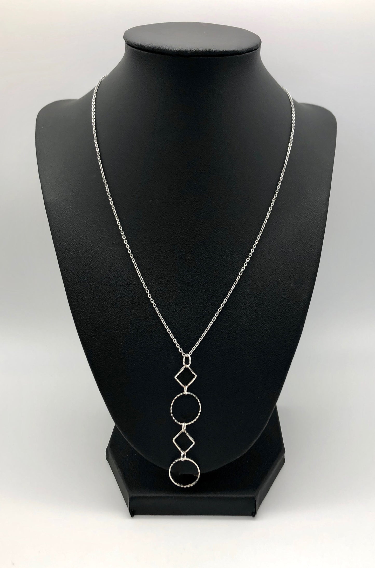Silver-plated laser cut circle and diamond shape pendant on chain necklace