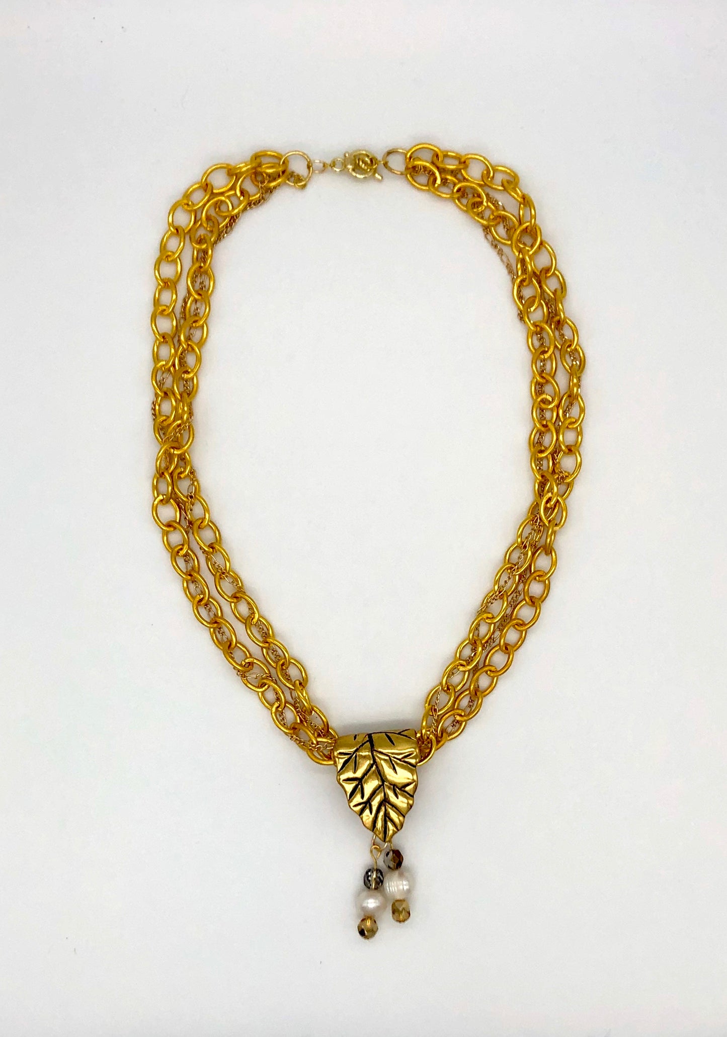 Gold plated large chain with leaf bail and freshwater pearl glass bead detail necklace