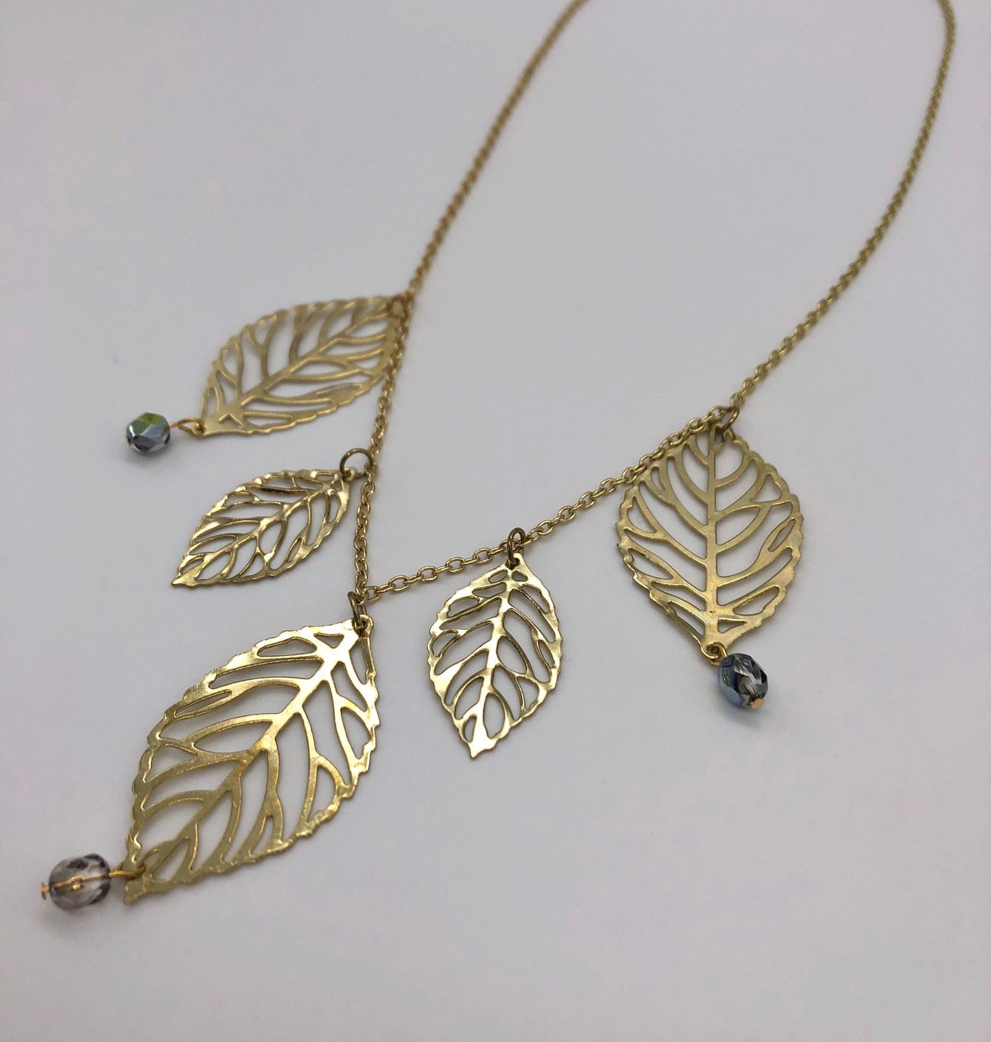 Gold plated leaf cutout dangles chain necklace
