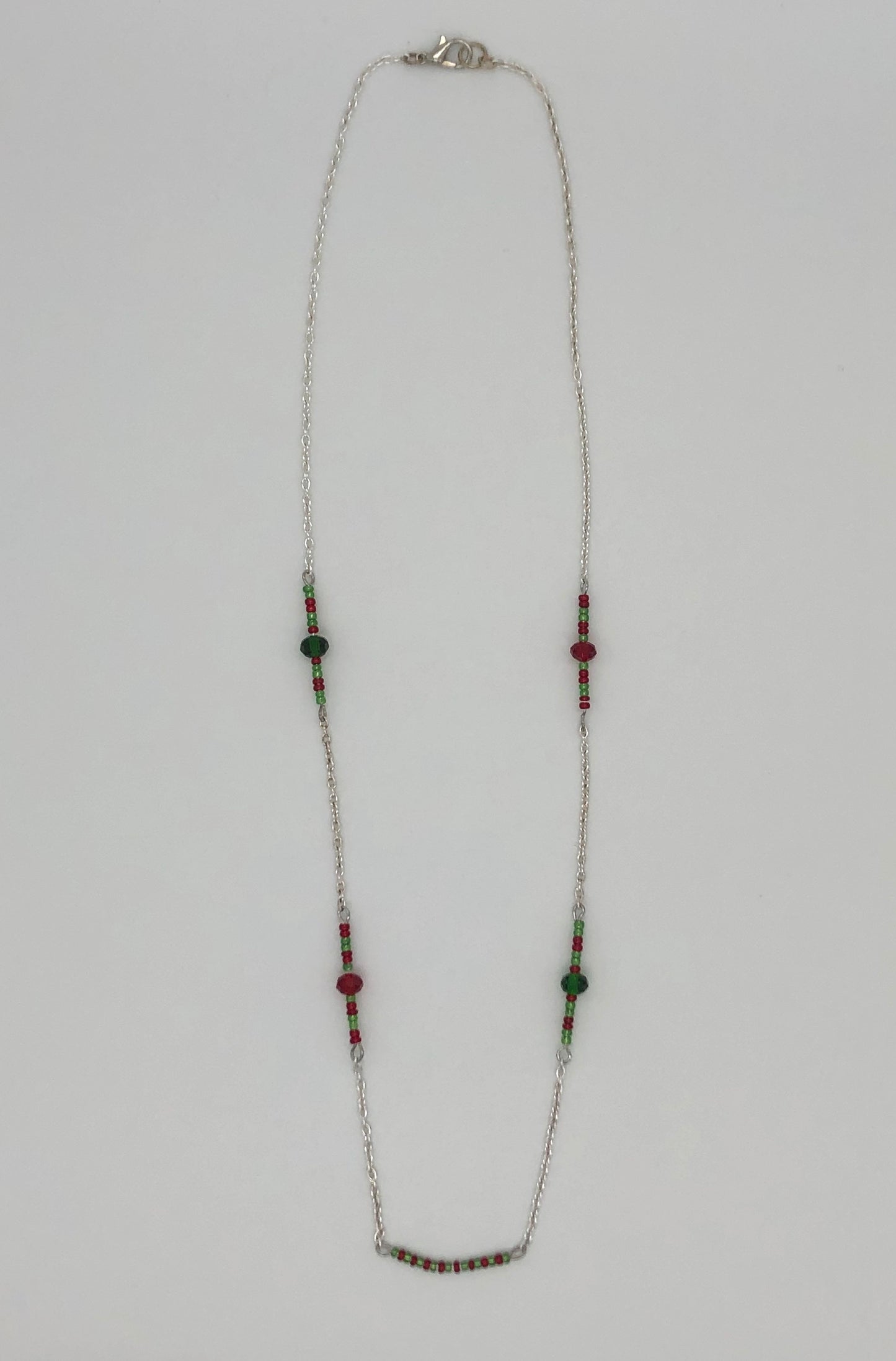 Silver cable chain with red and green seed bead accent necklace