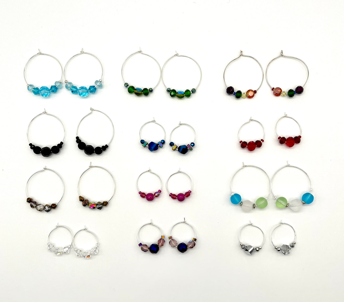 Silver hoop earrings with glass bead detail