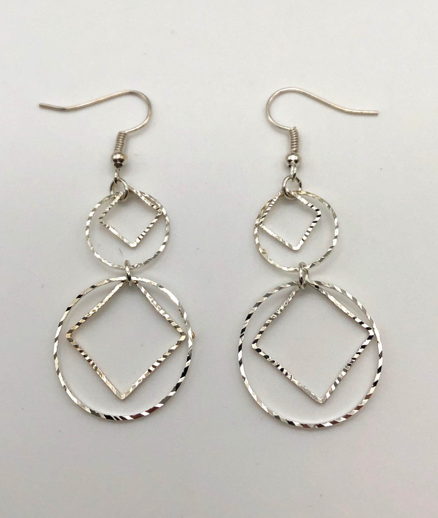 Diamond and circle cutouts drop earrings