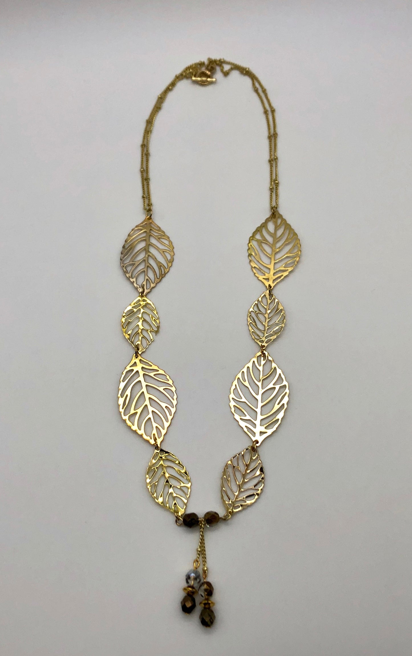 Gold leaf with dangle and double gold ball chain necklace