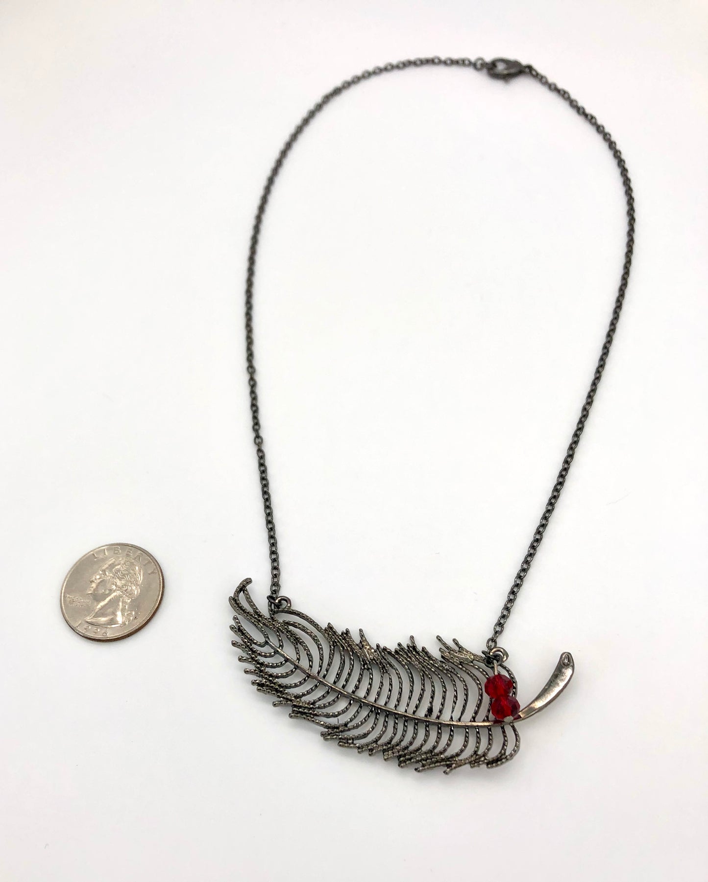 Feather necklace with red bead accents