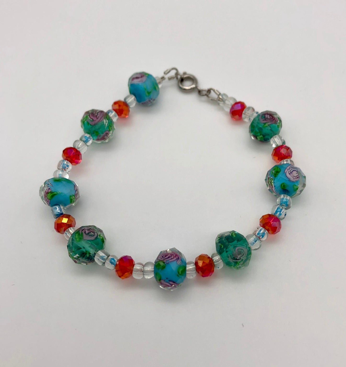 Lampwork blue and pink bead with rose detail bracelet