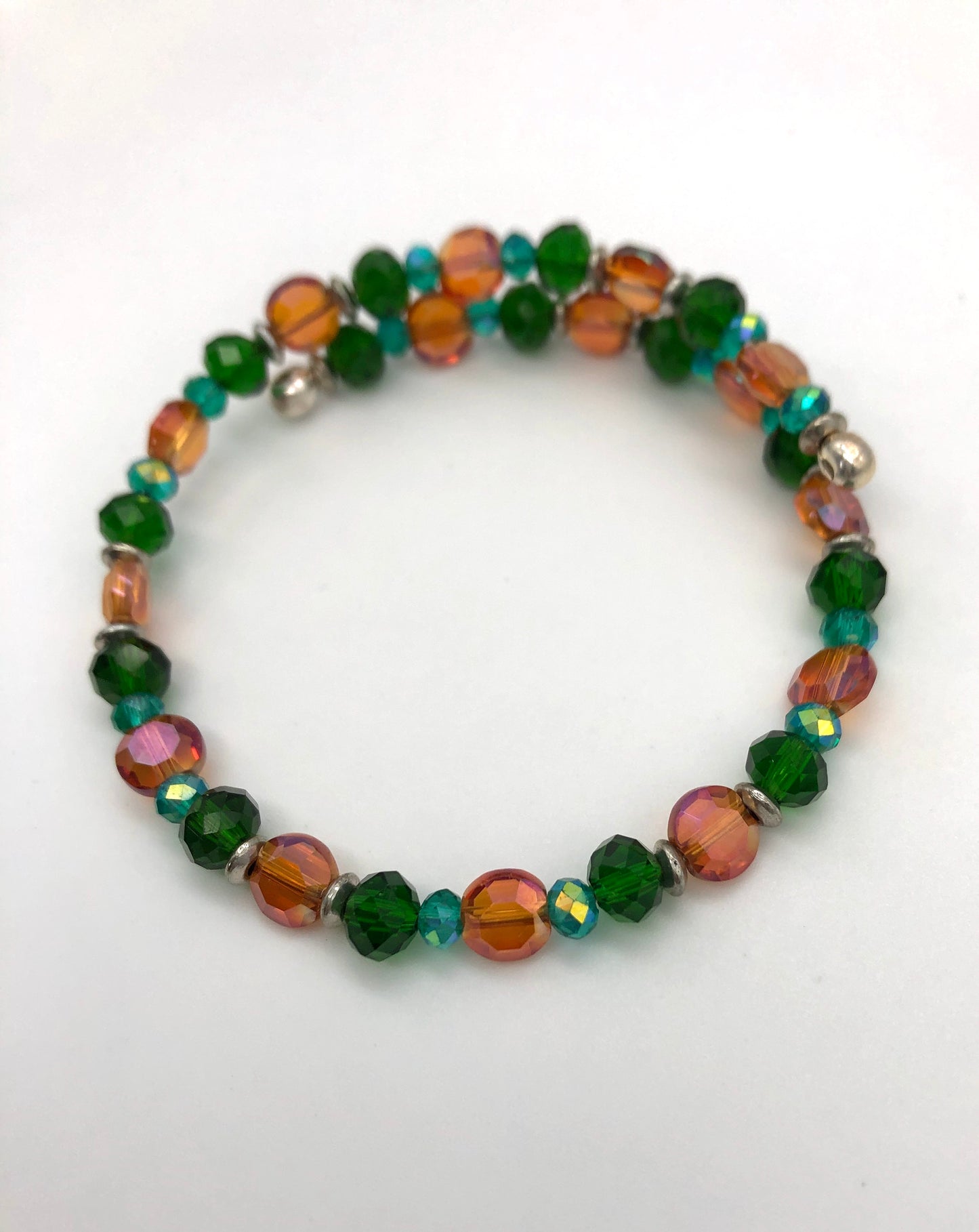 Orange lentil and green faceted beaded memory wire bracelet