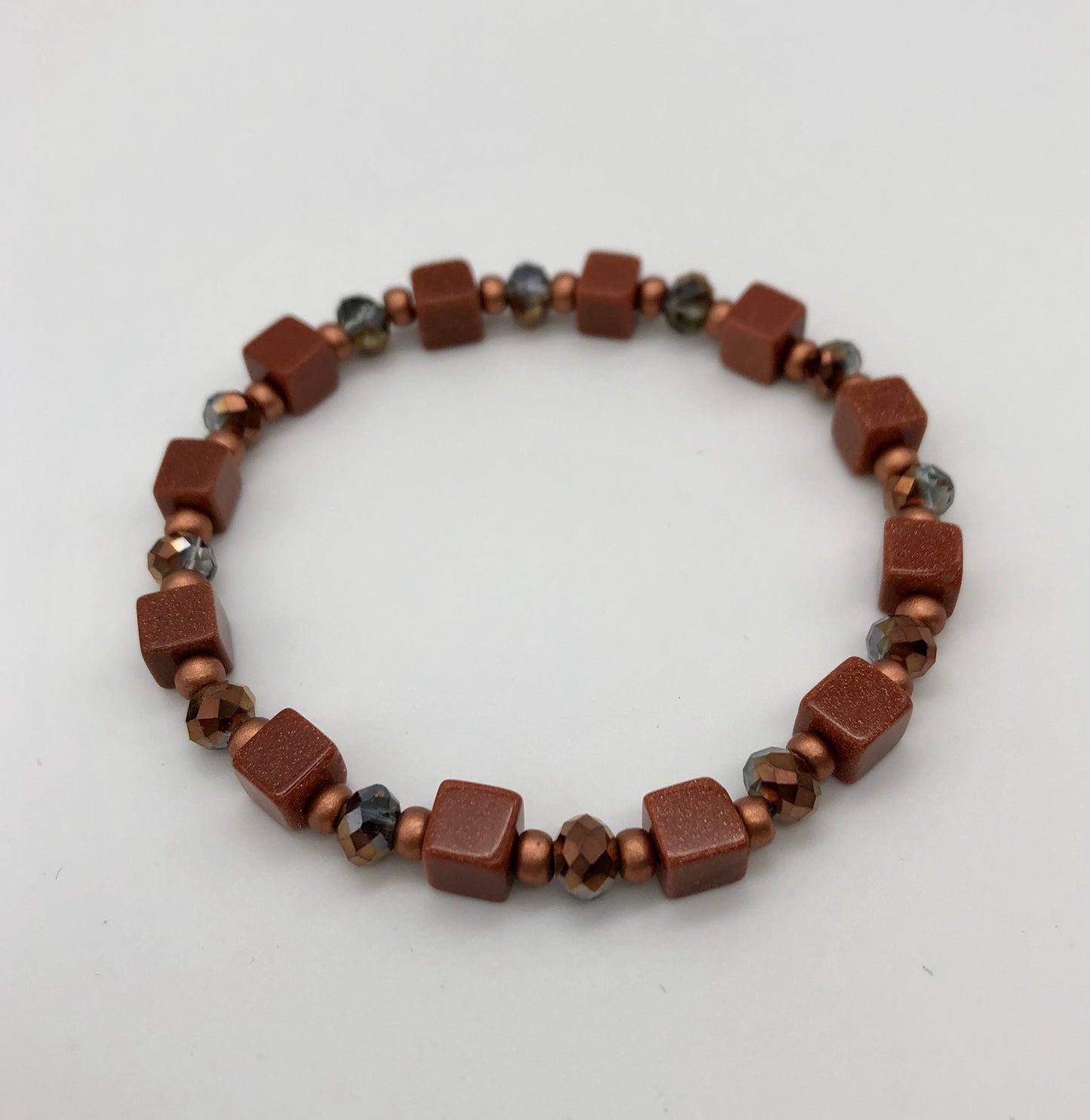 Goldstone and amber bead stretch bracelet
