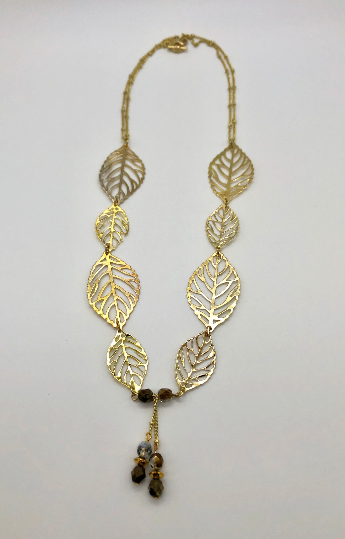 Gold leaf with dangle and double gold ball chain necklace
