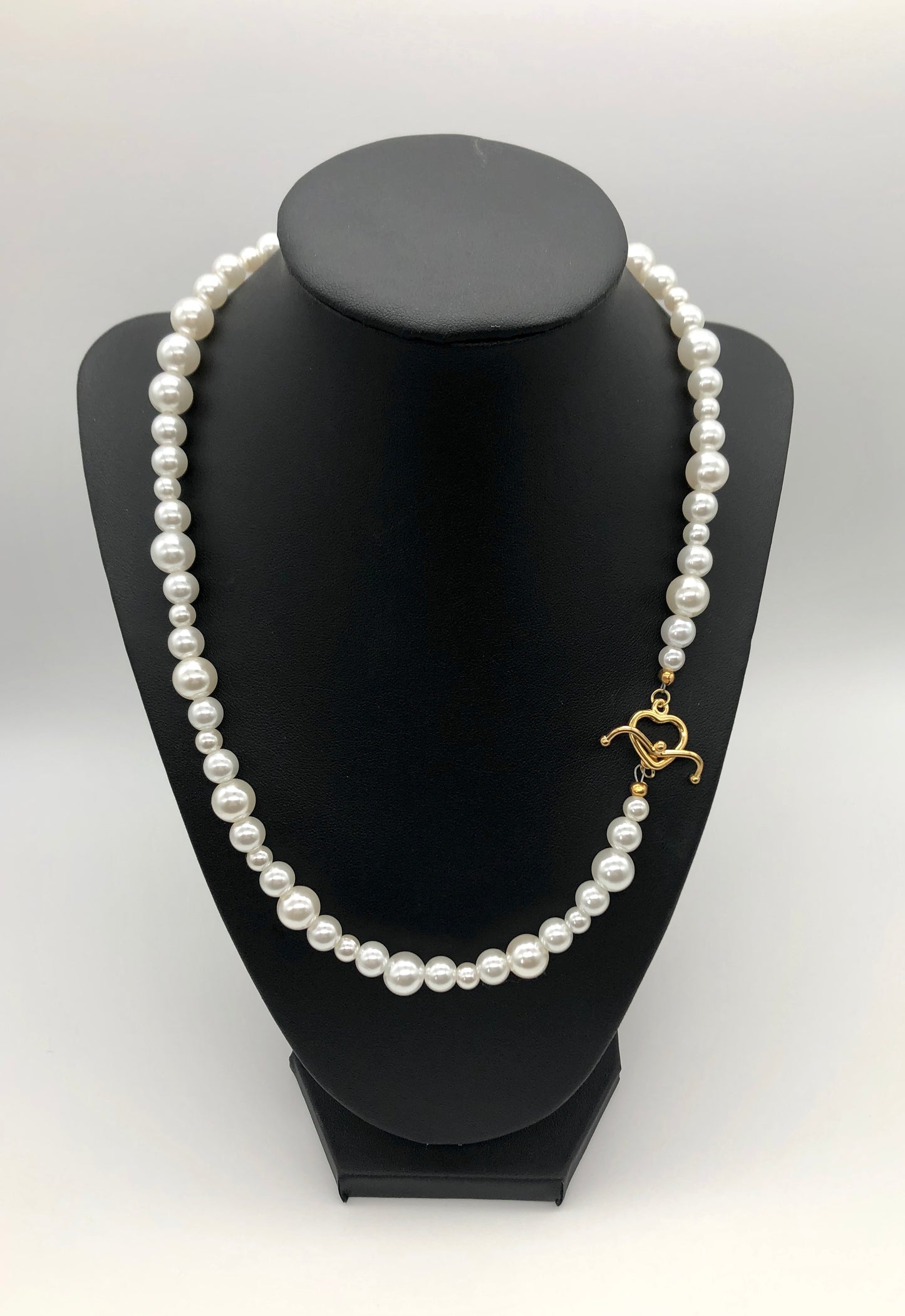 Faux pearl bead necklace with gold plated heart toggle clasp