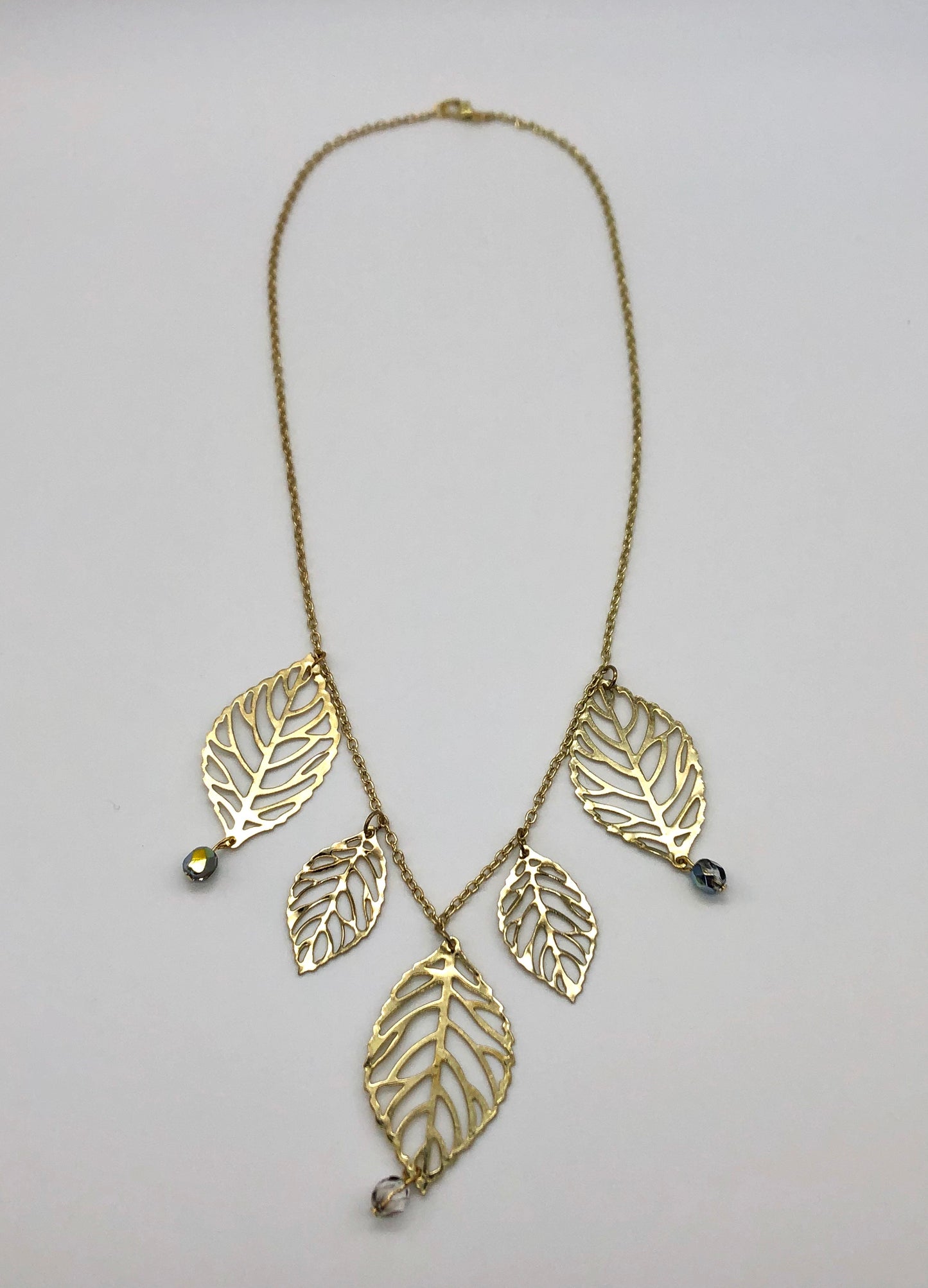 Gold plated leaf cutout dangles chain necklace
