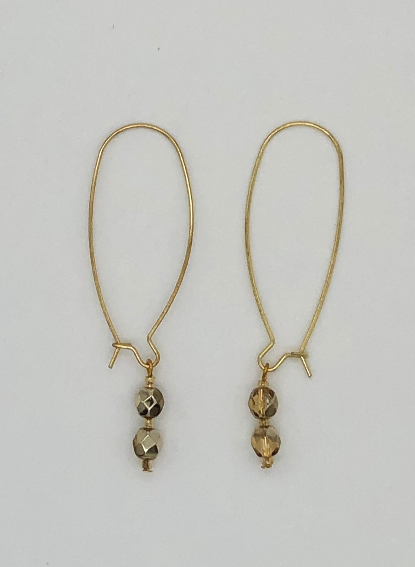 Gold large loop kidney earrings