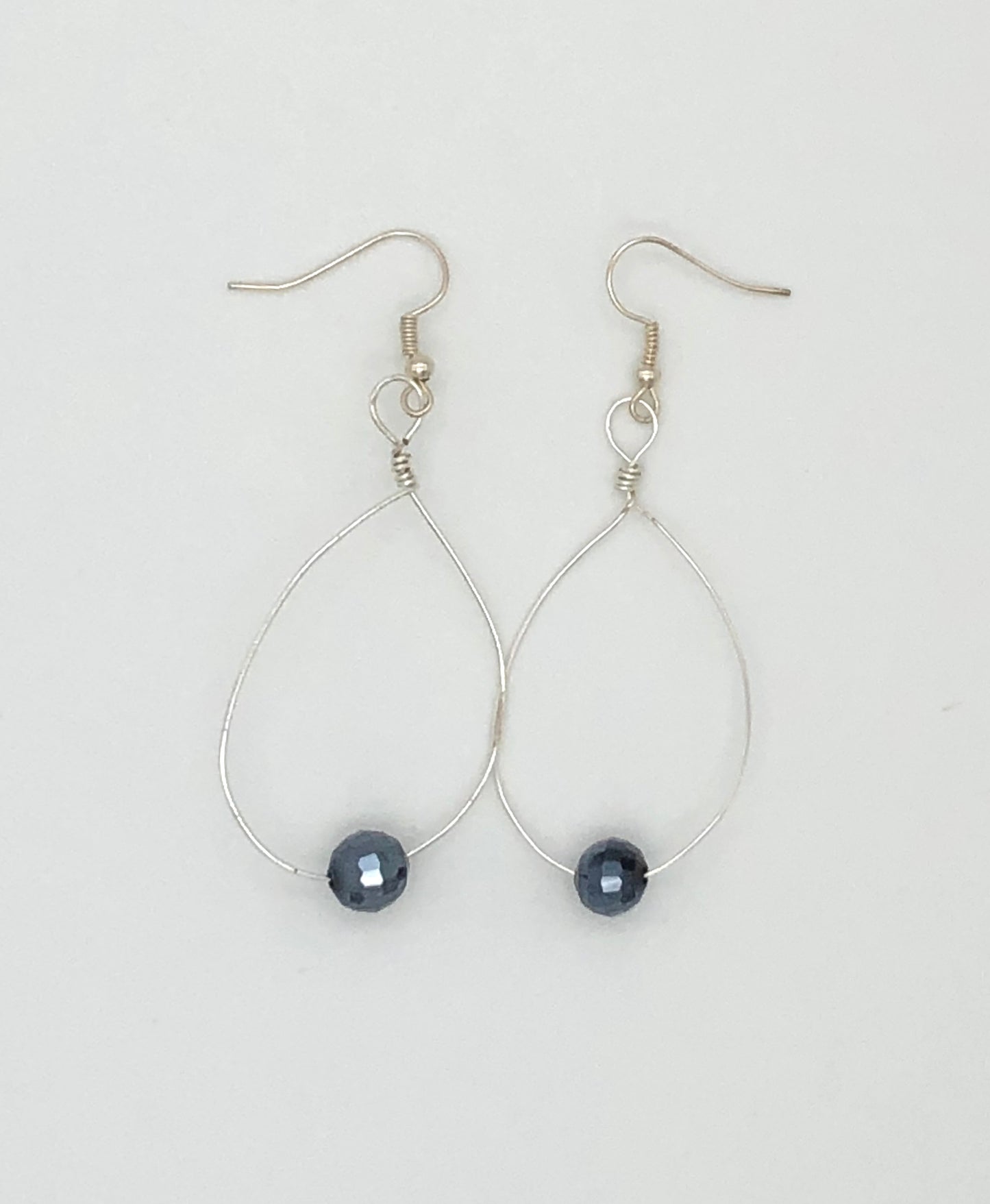 Long wire wrapped loop with dark grey sparkly beads earrings