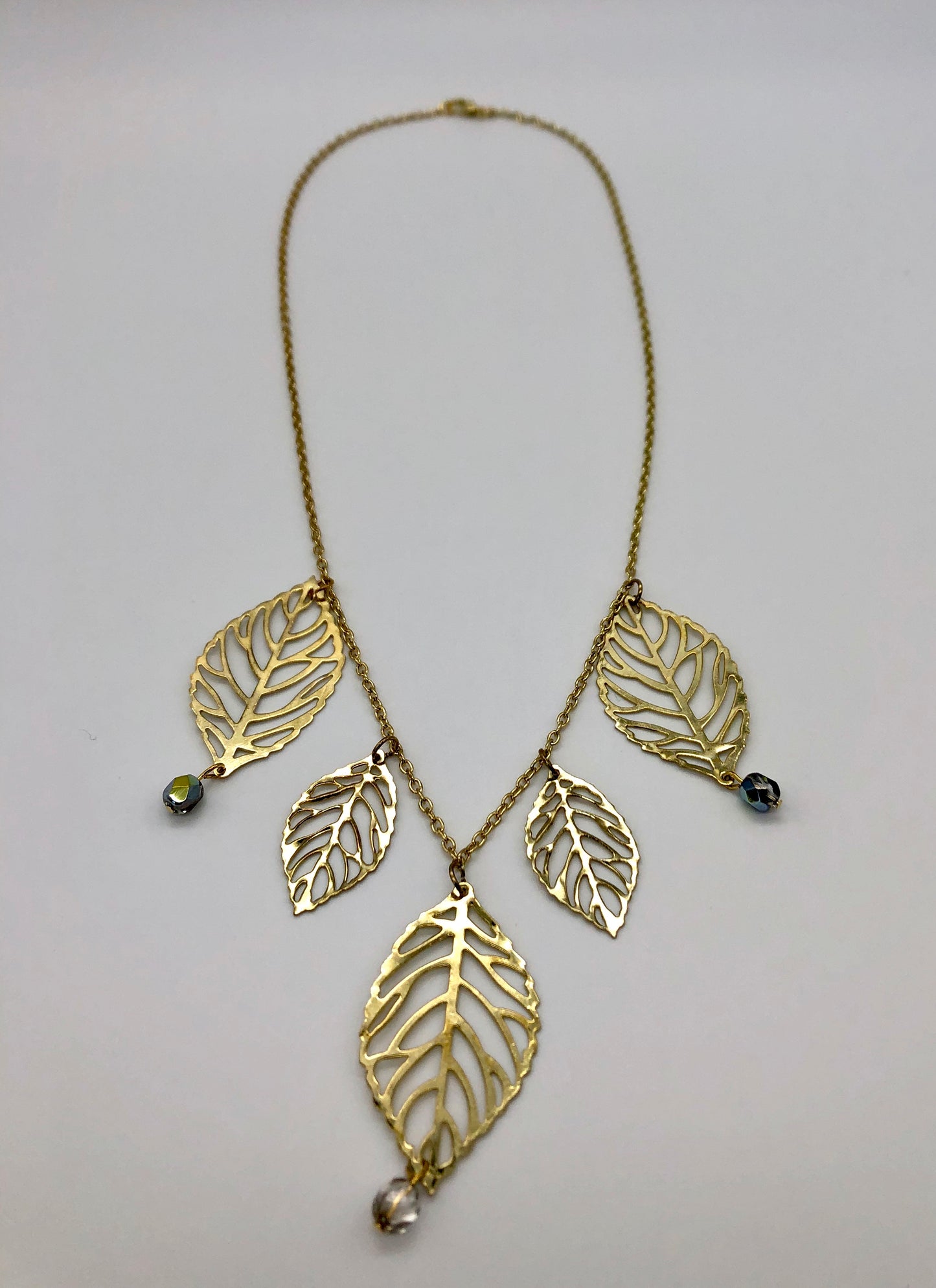 Gold plated leaf cutout dangles chain necklace